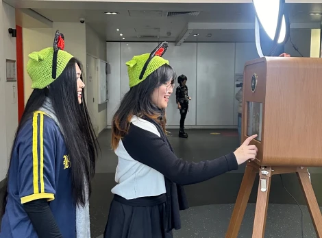 Customers interacting with a photobooth